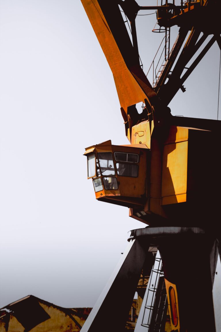 Close-up of a large industrial crane at a construction site in France.
